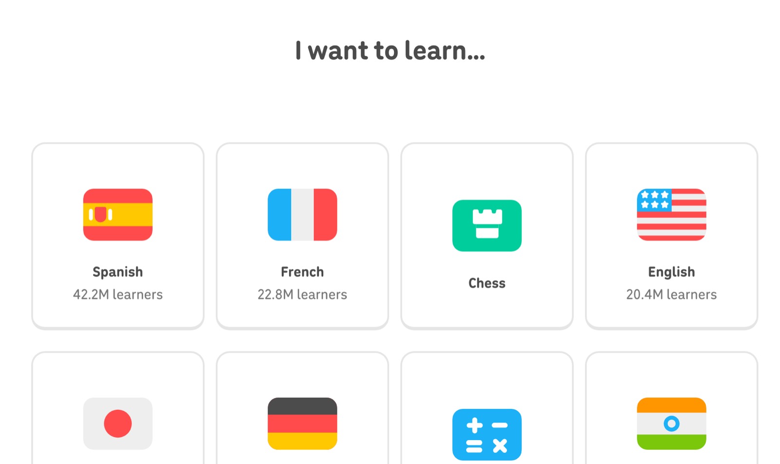 Duolingo’s “I want to learn...” screen with course cards for Spanish, French, Chess and English